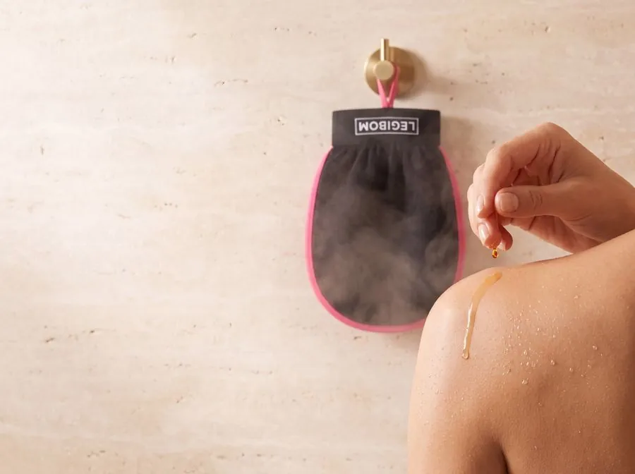 Body oil on freshly exfoliated skin, Legibom mitt hanging to dry